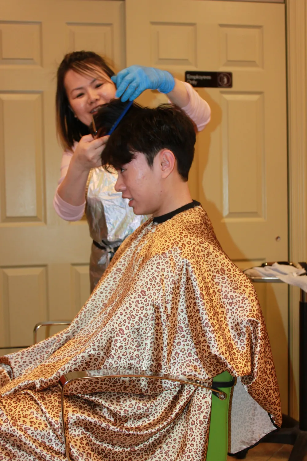 Vicky styling a client's hair